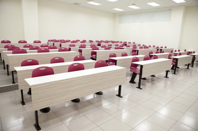 classroom system with auto-return chairs burgundy and fix table in Beirut
