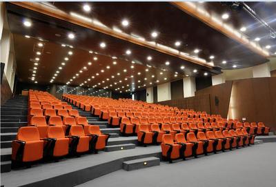 Orange auditorium chairs with folding tablet in Lebanon