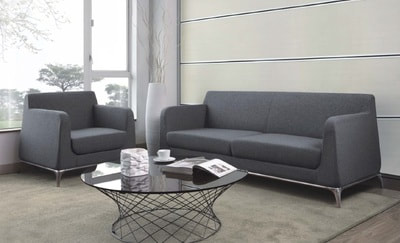 set of comfortable sofa in grey fabric with round glass coffee table and mesh frame