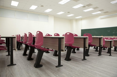 training room with auto-return burgundy polypropylene chairs and fix table