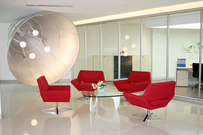 modern set of 4 petalo armchair in red fabric and glass center table for lounge area.