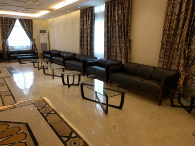 set of sofa black leather with neoclassic glass table for luxury reception