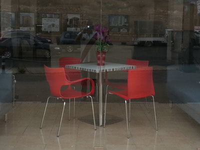 red plastic chair with chrome cafeteria table  in Beirut