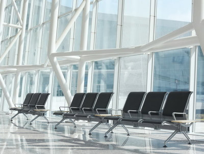 aluminum benches with black leather seat and back for airport waiting areas
