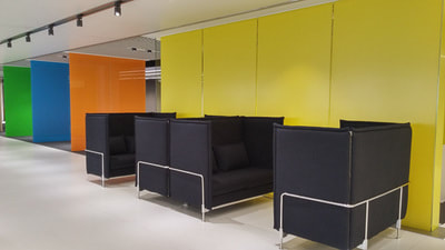 modern dark grey sofa for private discussion in lounge area